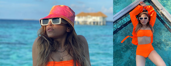 Celebrity Stylist Sukriti Grover : Takes our bikini a notch up by styling it with that tie and dye bucket hat and those statement sunglasses.